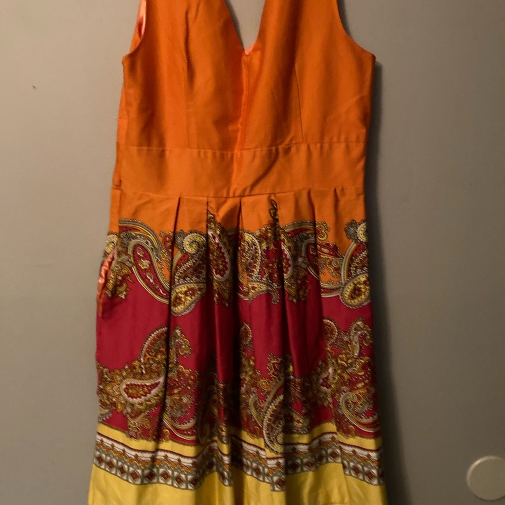 Spense sleeveless, V neck waisted, pleated dress
